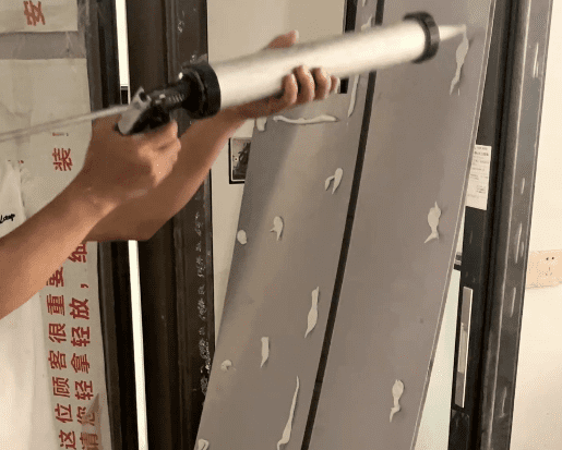 Applying Adhesive Behind the Wall Panel